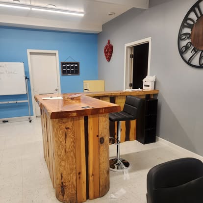 Welcoming reception area with a rustic wooden counter